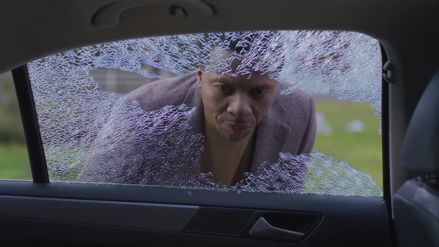 Man sees a baseball break his car window
