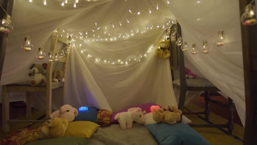 Lights are strung in the blanket tent