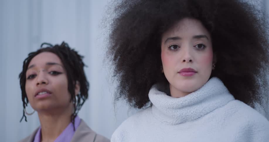 Two women are walking and talking