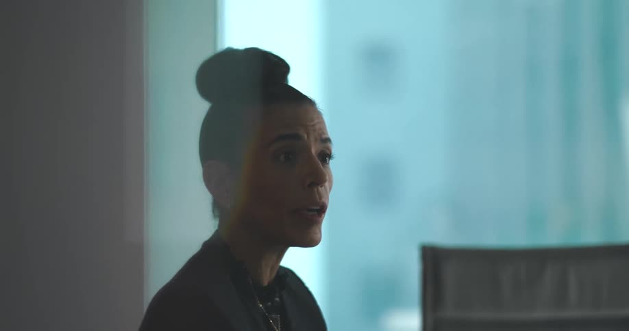 Woman talking while sitting at an office desk