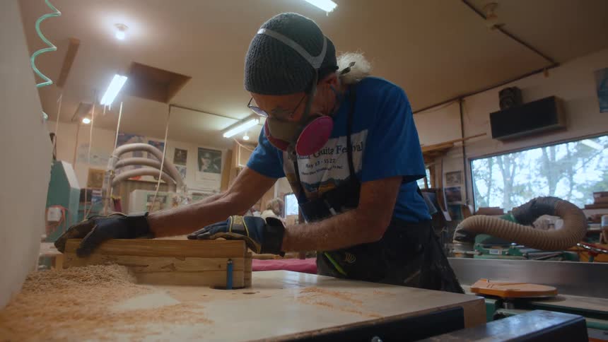 A footage of a carpenter working indoor