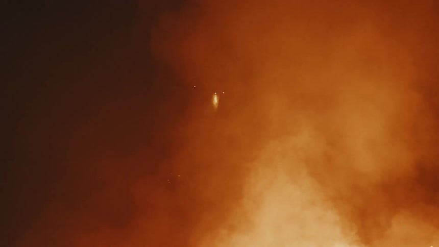 Smoke rises into the sky