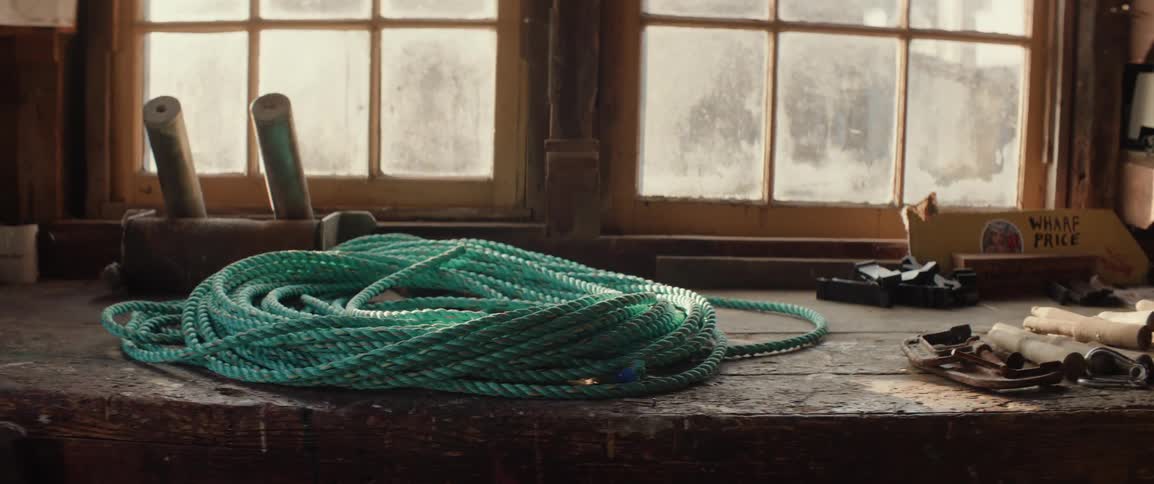 Rope is sitting on the counter by the window