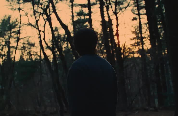 A man is worried while searching around the forest