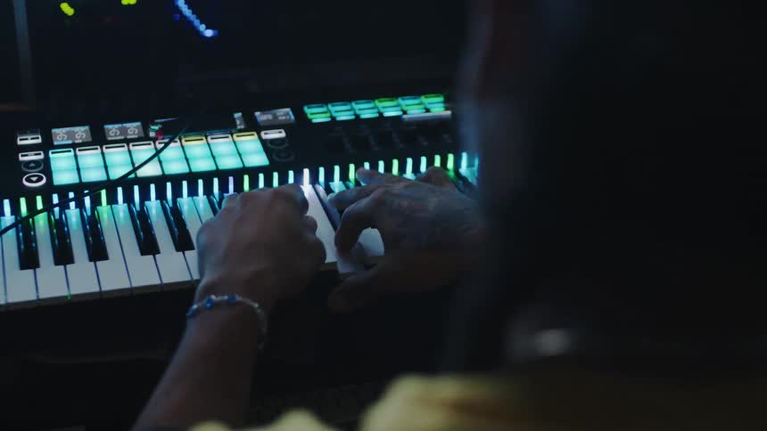 Pair of hands of a person playing the piano