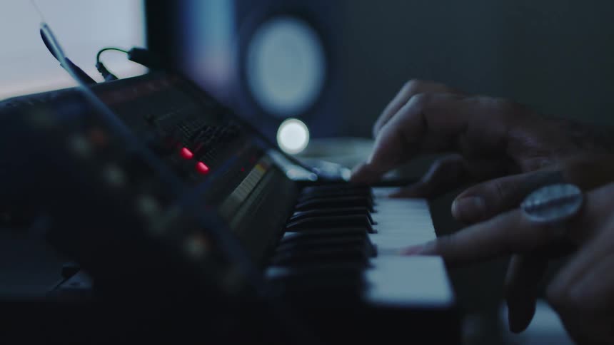 Pair of hands playing piano