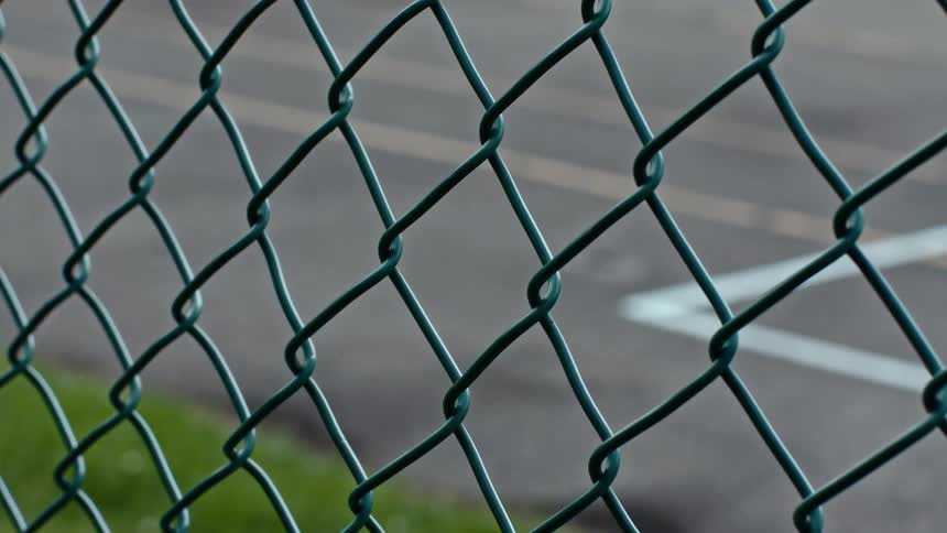 Looking through a chain link fence