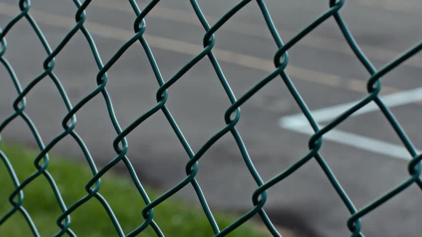 Looking through a steel wire fence