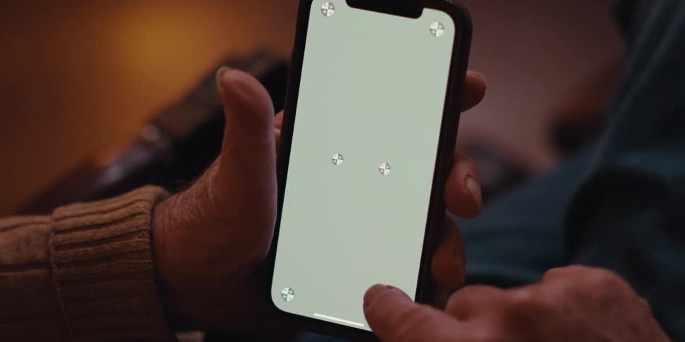 Closeup of a persons fingers interacting with a smartphone