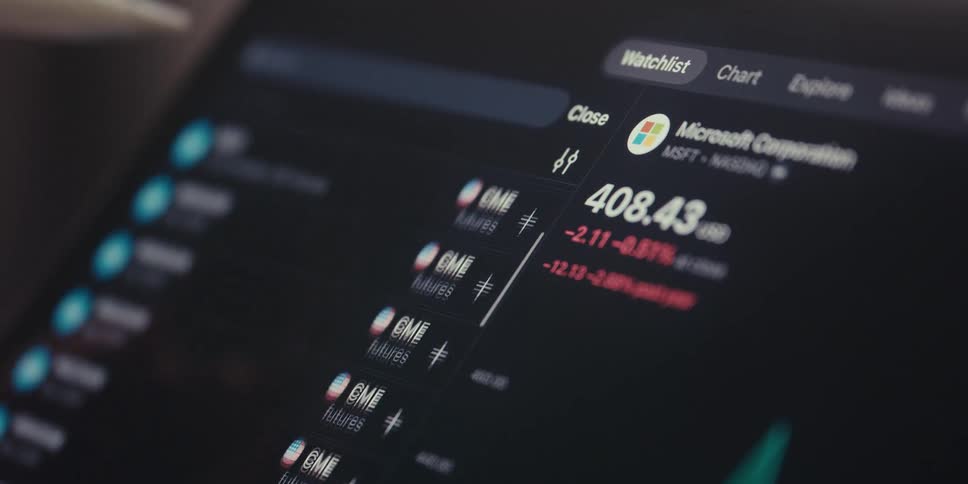 A digital stock trading interface displaying microsofts stock performance with a negative change along with a watchlist containing cme futures and a stylus interacting with the screen