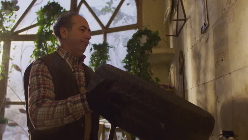 Man examining an old tire