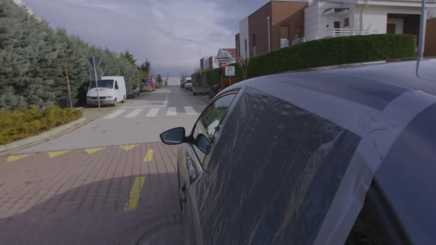Vehicle with broken rear window moving through the city