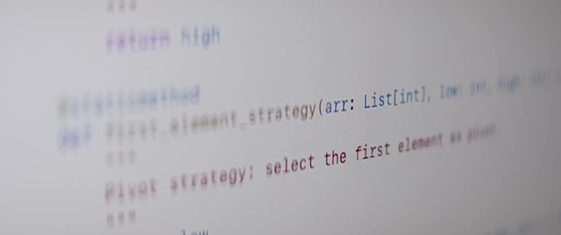 Closeup ofcomputer program code scrolling on the monitor