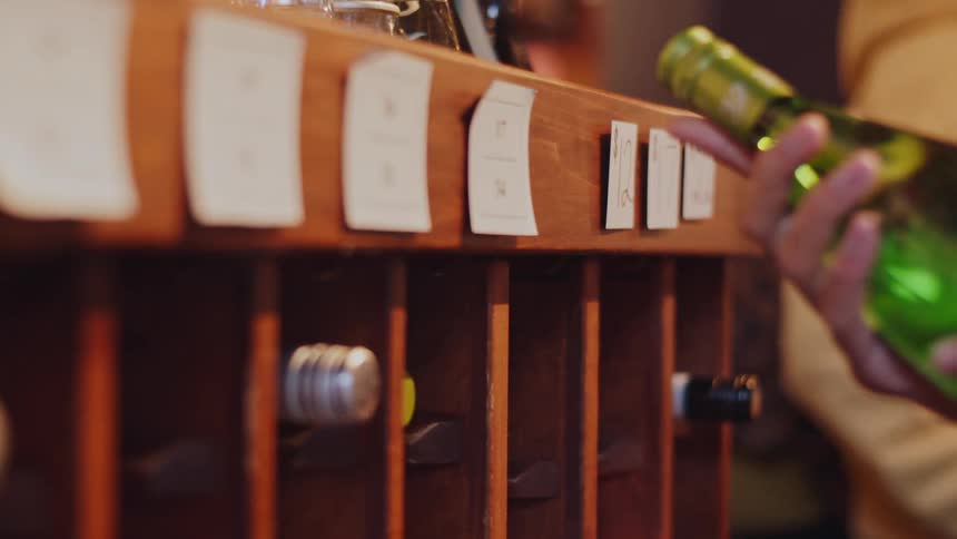 People are shopping for wine in the store