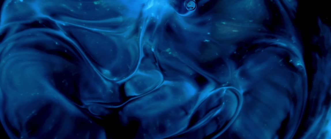 A dark blue liquidshaped element that is moving in an abstract way