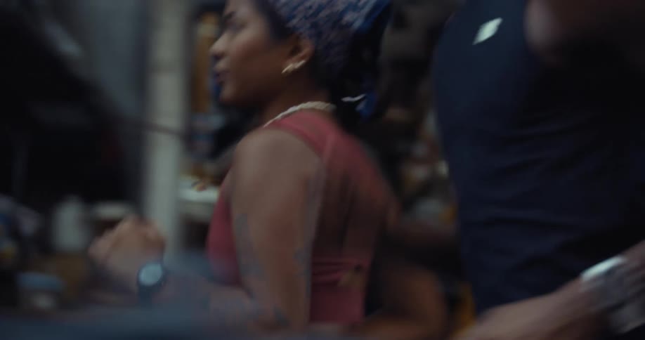 A footage of a lady and a man running
