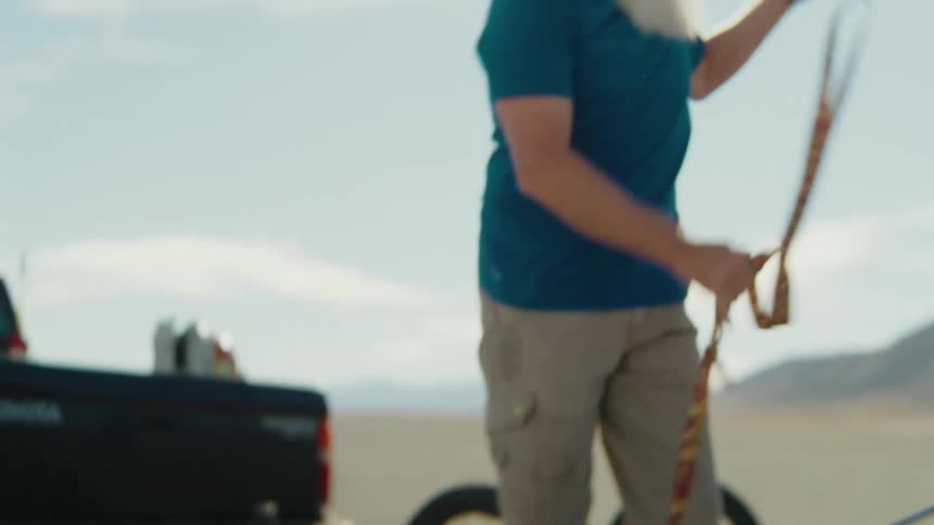 Bearded man removing seat belt in a vehicle