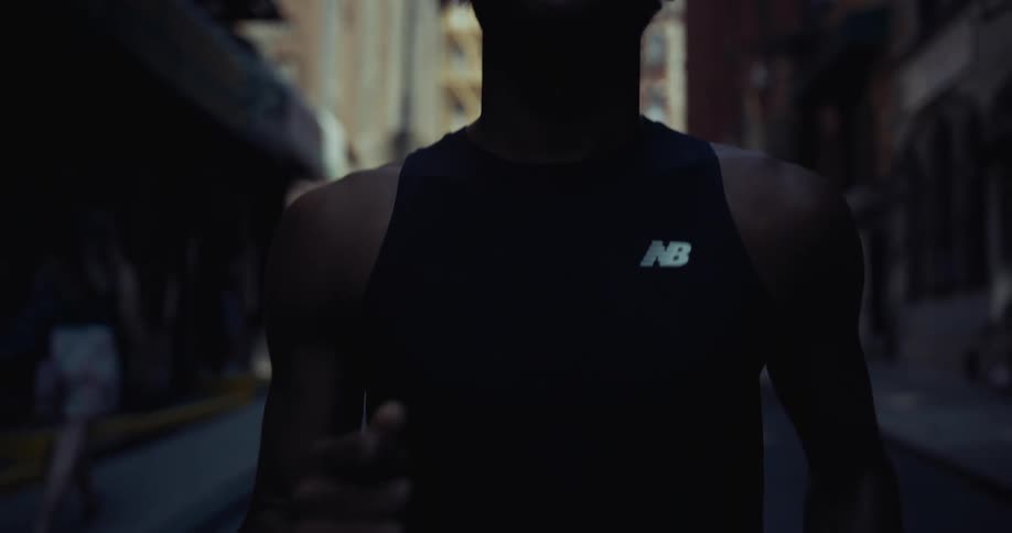 Person running through the city during the day