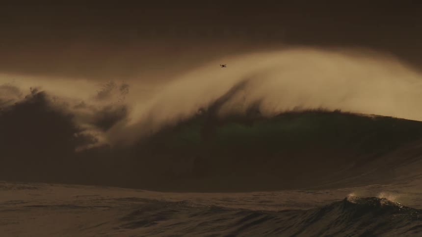 Surfers riding big waves