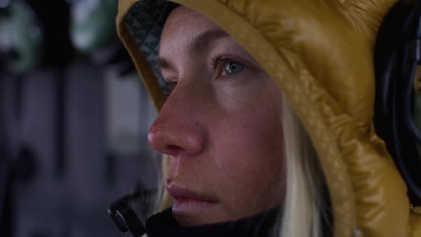 Portrait of a blonde woman with headphones