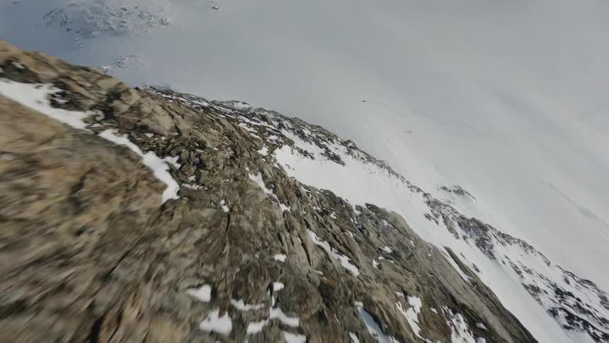 People ski past the tall mountain