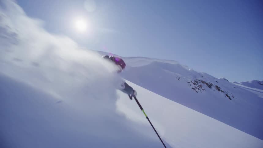 Person skiing down a mountain at high speed