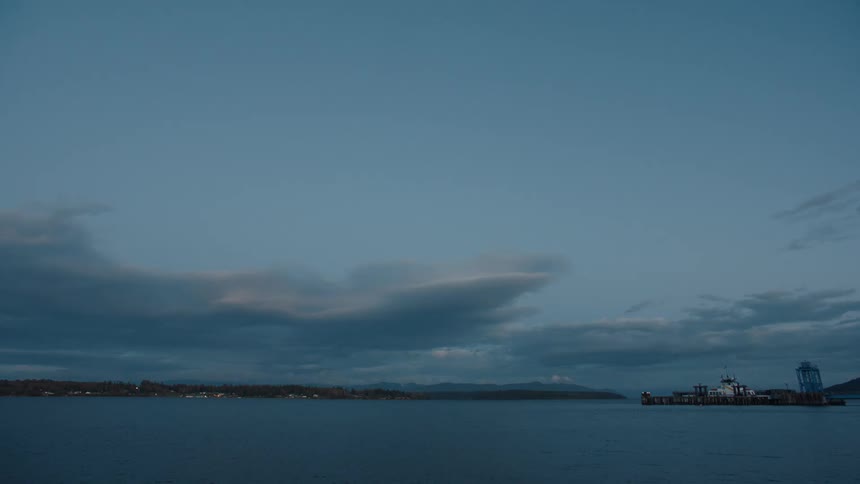 The sun is rising on the pier