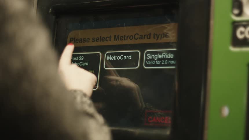 Payment machine screen while a person presses a button