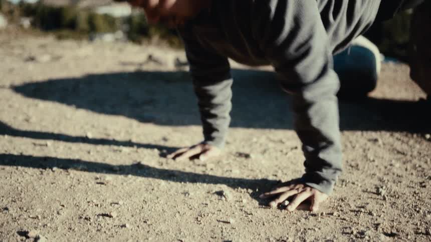Man in cap doing pushups