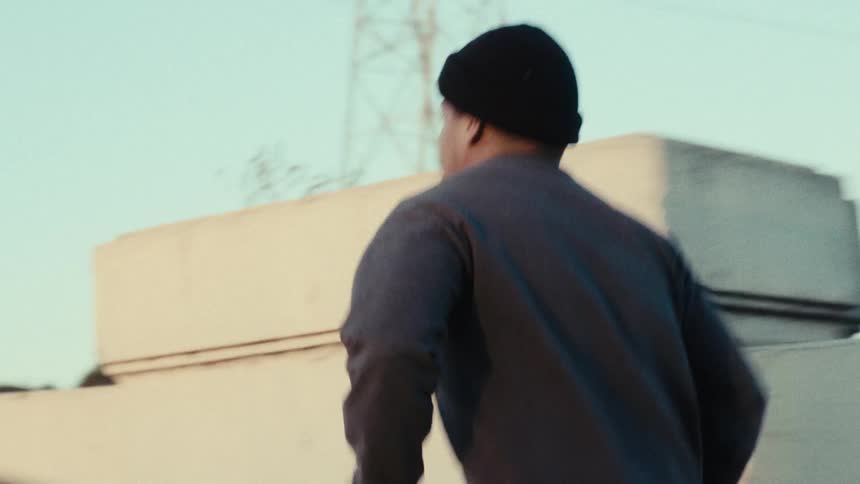 Man in cap running outdoors
