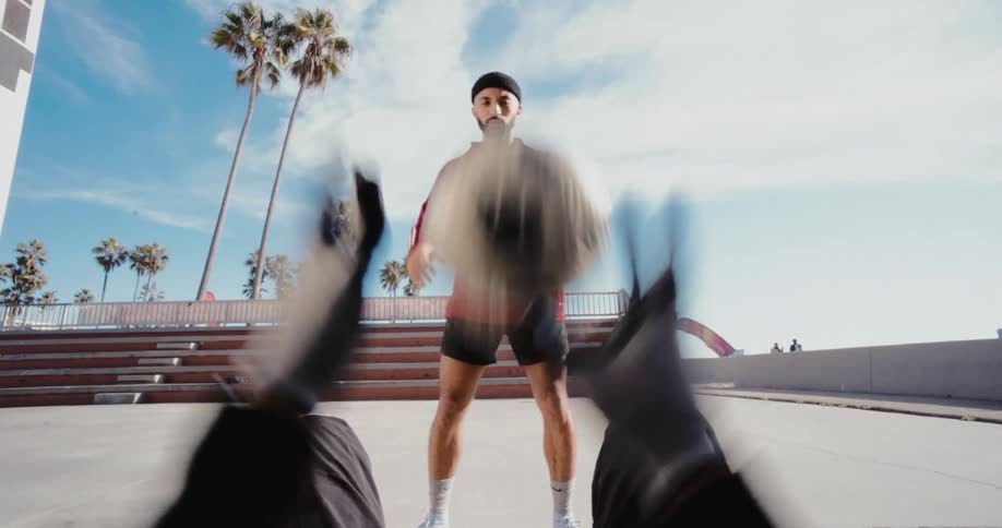 Point of view of a man greeting the other in a vibrant manner and starting the training by throwing the ball to each other