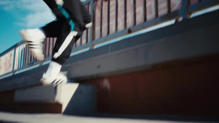 Man running up and down cement stairs outdoors