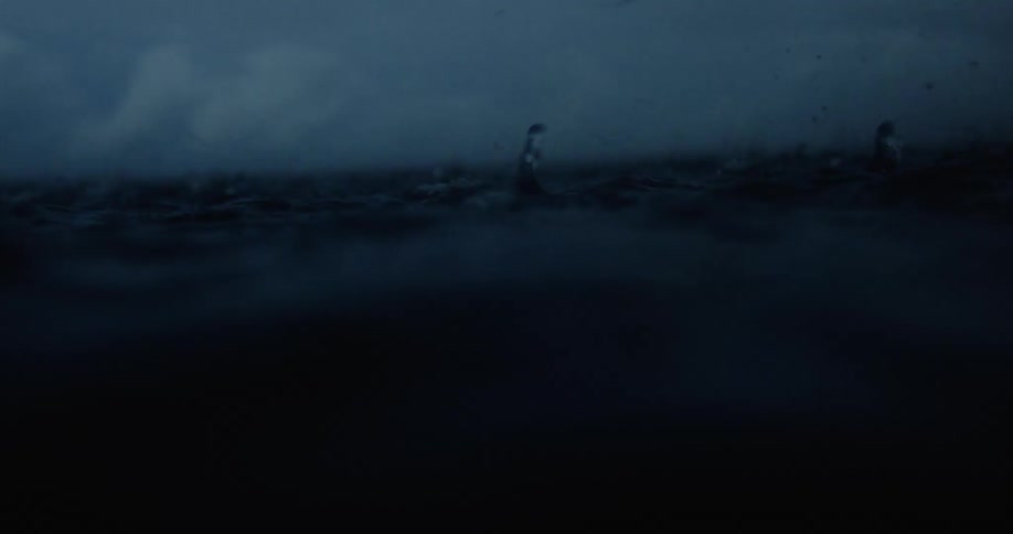 Close up of ocean with drops and calm waves