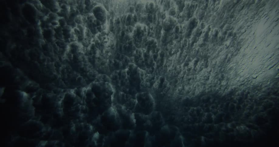 View from inside the sea water and a breaking wave