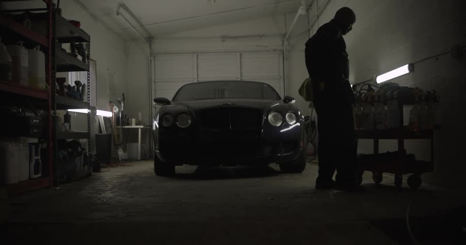 A mechanic is working in the garage