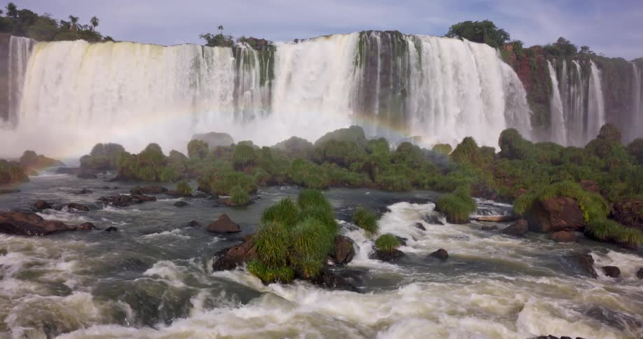 Large waterfalls create a rainbow