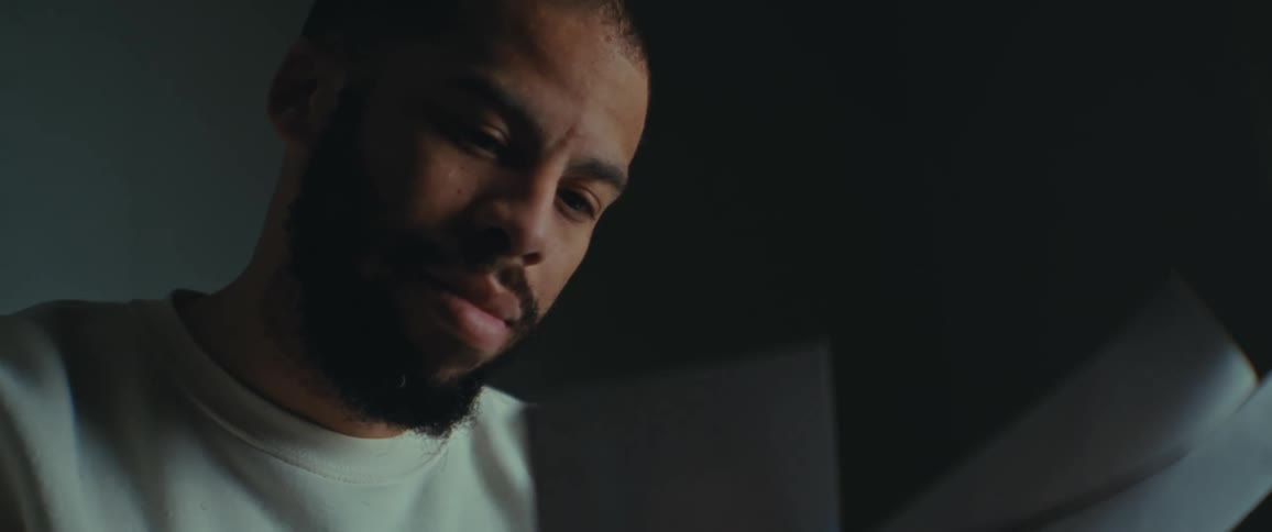 A man is reading over notes