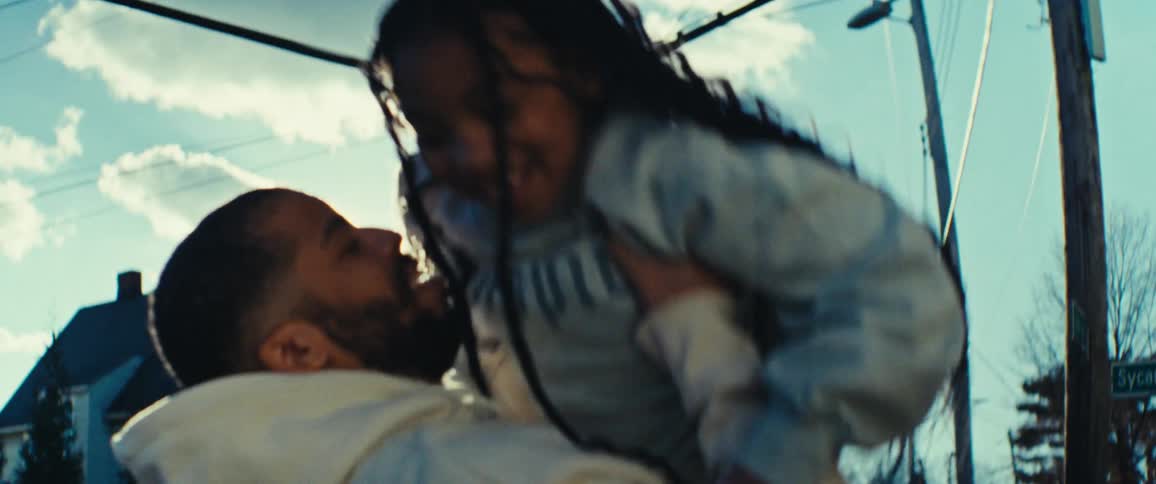 Father picking up his daughter and spinning her around