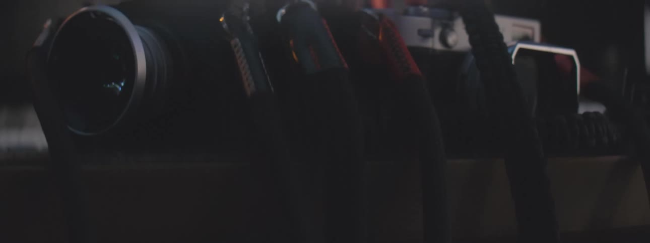 Cameras on a table connected by wires