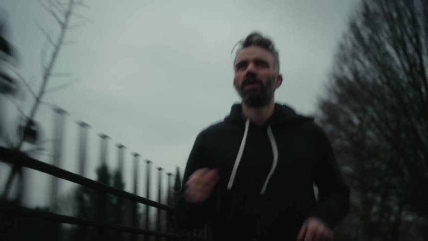 Man running outdoors on a cloudy day