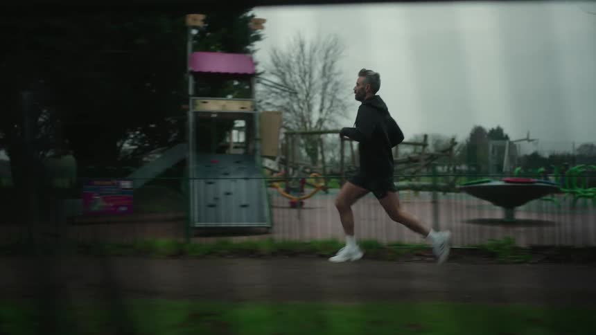 Man running outdoors on a cloudy day