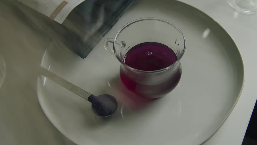 A person is preparing a drink