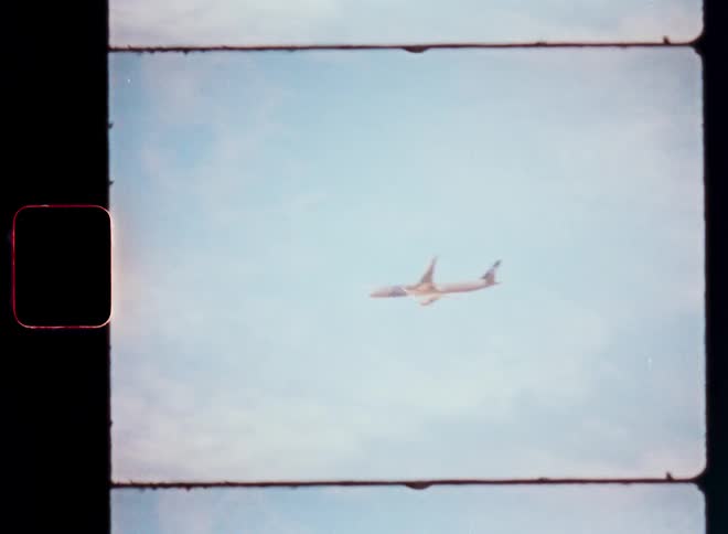 Passenger plane cruising at high altitude on a cloudy day