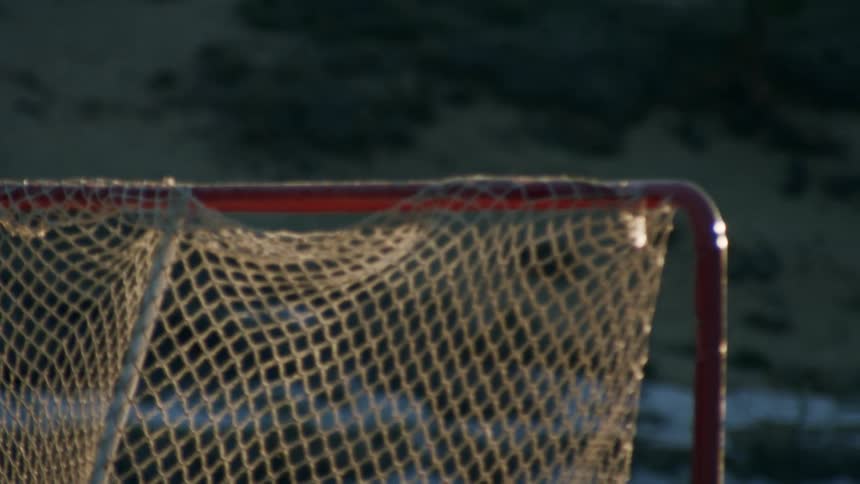 Person outdoors playing hockey