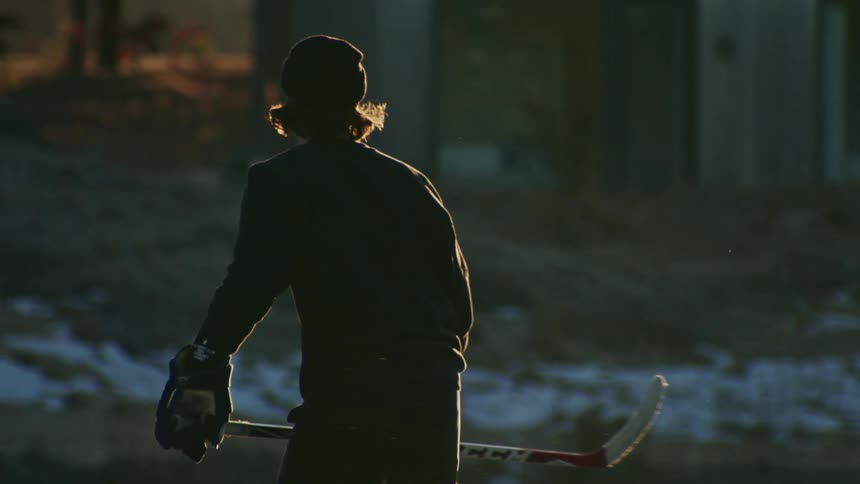 Two outdoor hockey players