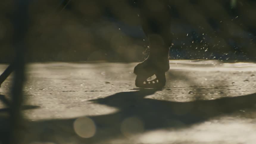 Legs of two people playing hockey