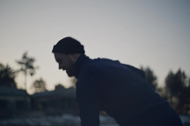 A man shoots the puck on the ice