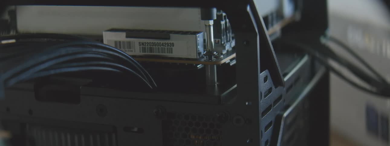 Screwdriver screwing a screw into a hardware