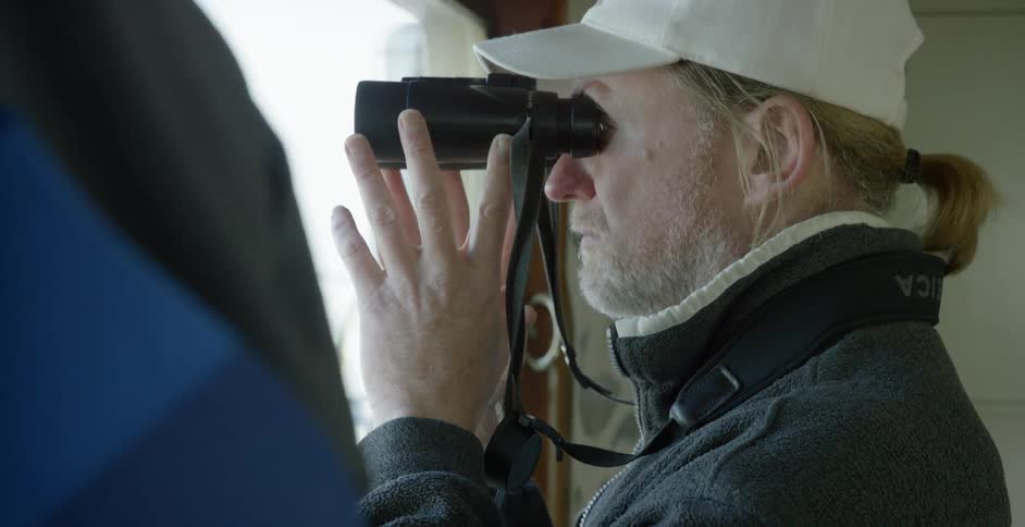 A person is using binoculars