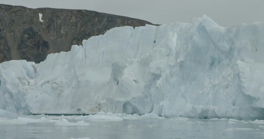 Iceberg floating on a clear day